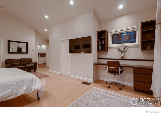 3421 4th St, Boulder, CO 80304 - bedroom featuring built in study area, lofted ceiling, recessed lighting, and light wood-style flooring