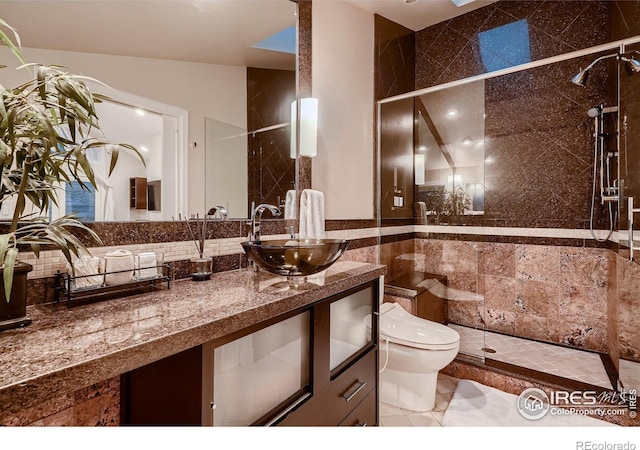 3421 4th St, Boulder, CO 80304 - bathroom with vanity, tiled shower, tile walls, and backsplash