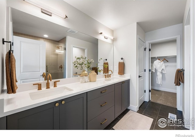 648 Greenspire Dr Unit 6, Windsor, CO 80550 - full bathroom featuring double vanity, a shower stall, a spacious closet, and tile patterned flooring