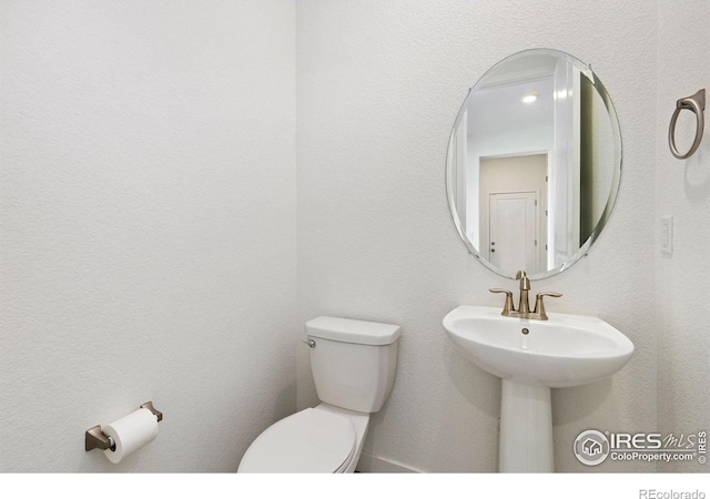 5226 Inland Ave, Firestone, CO 80504 - bathroom featuring toilet and a sink