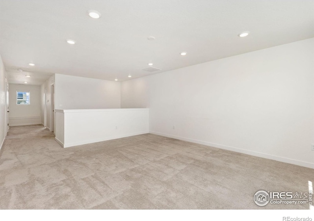 5226 Inland Ave, Firestone, CO 80504 - spare room with light colored carpet and recessed lighting