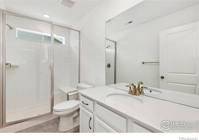 5226 Inland Ave, Firestone, CO 80504 - full bathroom with vanity, a stall shower, and tile patterned floors