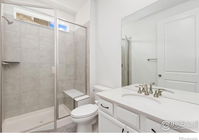 5226 Inland Ave, Firestone, CO 80504 - full bath featuring vanity, a shower stall, and tile patterned floors