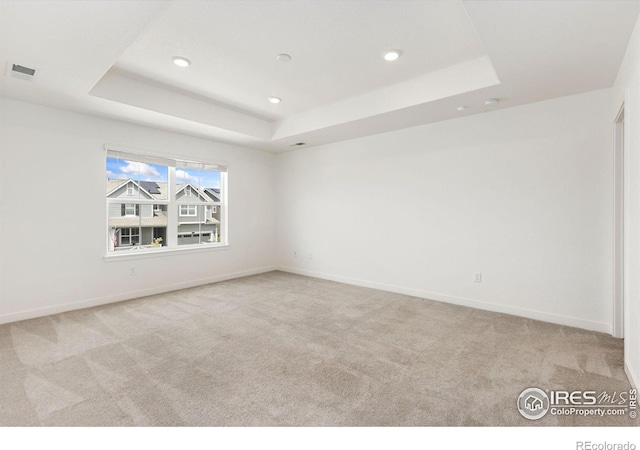 5226 Inland Ave, Firestone, CO 80504 - empty room featuring carpet, a raised ceiling, and recessed lighting