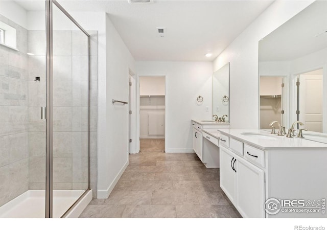 5226 Inland Ave, Firestone, CO 80504 - full bath with a spacious closet, double vanity, a shower stall, and recessed lighting