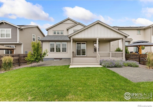 5226 Inland Ave, Firestone, CO 80504 - view of front facade featuring a gazebo, board and batten siding, covered porch, and a shingled roof