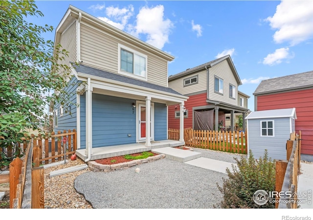 67 Quail Rd, Longmont, CO 80501 - view of front facade with a porch and a storage shed