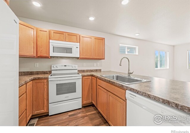 67 Quail Rd, Longmont, CO 80501 - kitchen featuring white appliances, dark wood-style floors, and recessed lighting