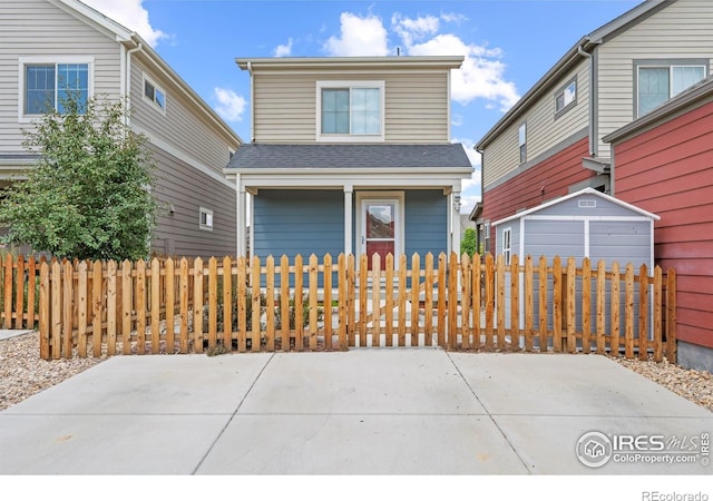 67 Quail Rd, Longmont, CO 80501 - view of front of home with a fenced front yard, a porch, and roof with shingles