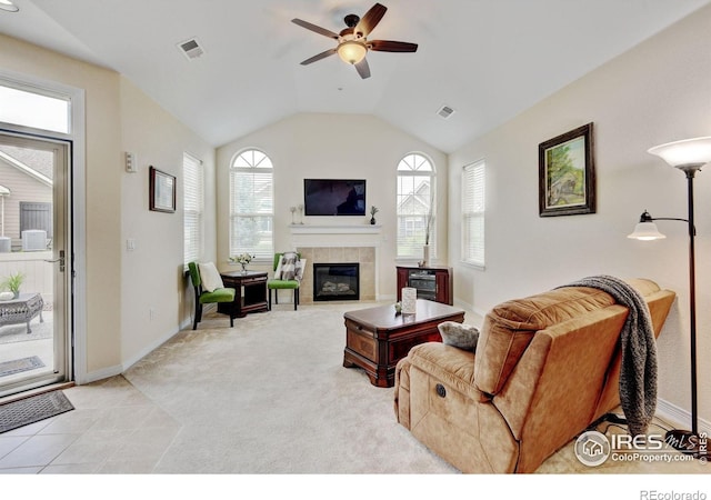 2421 Santa Fe Dr Unit B, Longmont, CO 80504 - living room with ceiling fan, a fireplace, vaulted ceiling, and light carpet