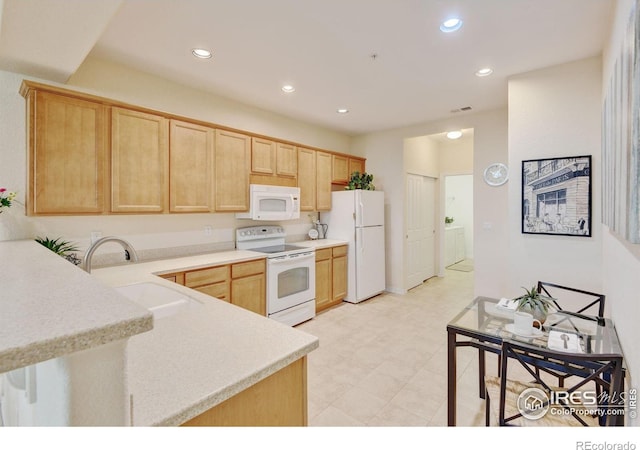 2421 Santa Fe Dr Unit B, Longmont, CO 80504 - kitchen featuring white appliances, light brown cabinetry, light countertops, recessed lighting, and light flooring