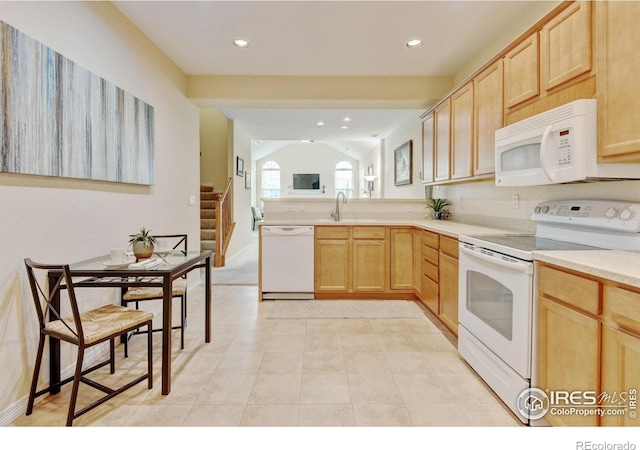 2421 Santa Fe Dr Unit B, Longmont, CO 80504 - kitchen with white appliances, light brown cabinetry, recessed lighting, light countertops, and a peninsula
