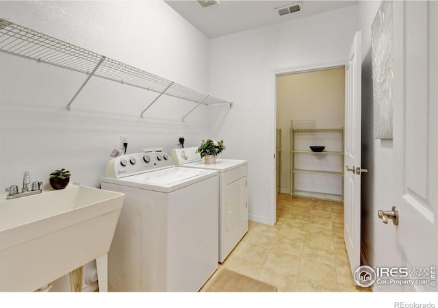2421 Santa Fe Dr Unit B, Longmont, CO 80504 - washroom featuring separate washer and dryer and baseboards