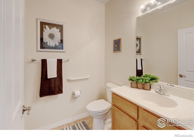 2421 Santa Fe Dr Unit B, Longmont, CO 80504 - half bathroom featuring vanity and tile patterned flooring