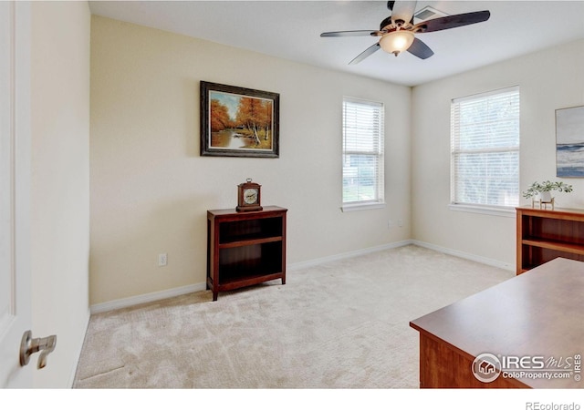2421 Santa Fe Dr Unit B, Longmont, CO 80504 - home office featuring ceiling fan and light colored carpet