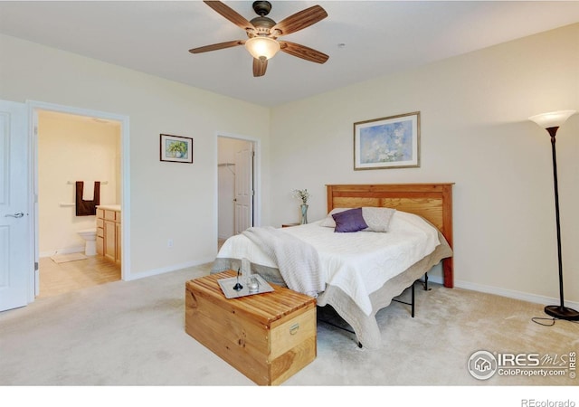 2421 Santa Fe Dr Unit B, Longmont, CO 80504 - bedroom with light carpet, ensuite bath, and ceiling fan