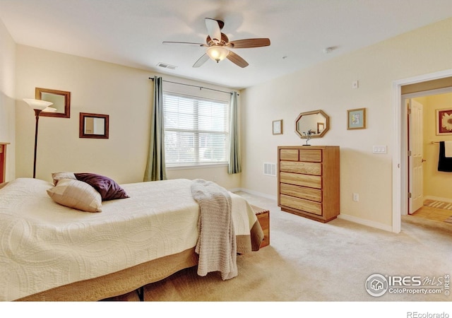2421 Santa Fe Dr Unit B, Longmont, CO 80504 - bedroom featuring light colored carpet and a ceiling fan