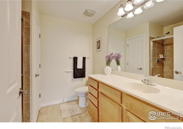 2421 Santa Fe Dr Unit B, Longmont, CO 80504 - bathroom featuring vanity, a tile shower, and tile patterned floors
