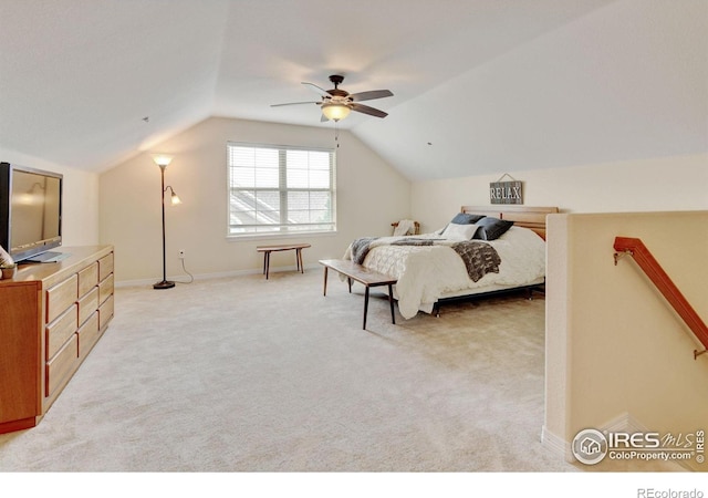 2421 Santa Fe Dr Unit B, Longmont, CO 80504 - bedroom with vaulted ceiling, light colored carpet, and ceiling fan