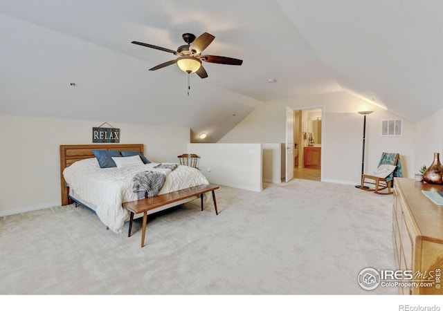 2421 Santa Fe Dr Unit B, Longmont, CO 80504 - bedroom with vaulted ceiling, light carpet, and a ceiling fan