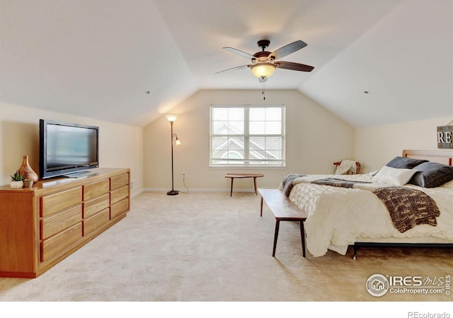 2421 Santa Fe Dr Unit B, Longmont, CO 80504 - bedroom featuring vaulted ceiling, light colored carpet, and a ceiling fan