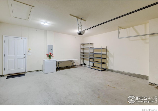 2421 Santa Fe Dr Unit B, Longmont, CO 80504 - garage with electric panel and a garage door opener