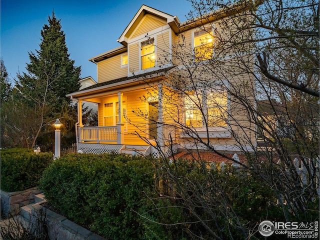 2946 Shoshone Trl, Lafayette, CO 80026 - traditional-style home with a porch