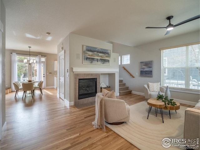 2946 Shoshone Trl, Lafayette, CO 80026 - living room featuring healthy amount of natural light, light wood-style floors, and a fireplace