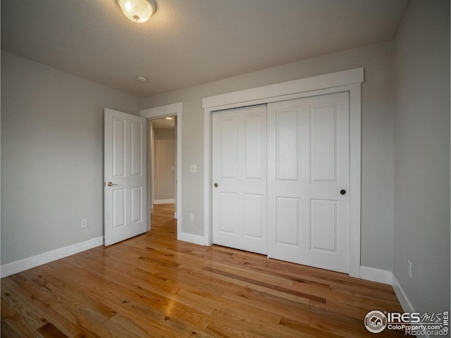 2946 Shoshone Trl, Lafayette, CO 80026 - unfurnished bedroom with light wood-type flooring and a closet