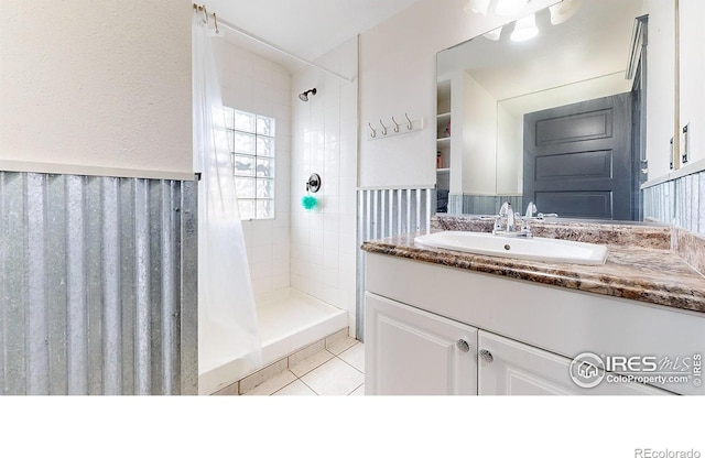 1825 7th Avenue Various, Greeley, CO 80631 - bathroom with a stall shower, vanity, tile patterned floors, and wainscoting