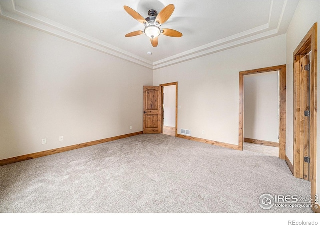 20199 Leola Way, Eaton, CO 80615 - unfurnished bedroom with carpet floors, a raised ceiling, and ceiling fan