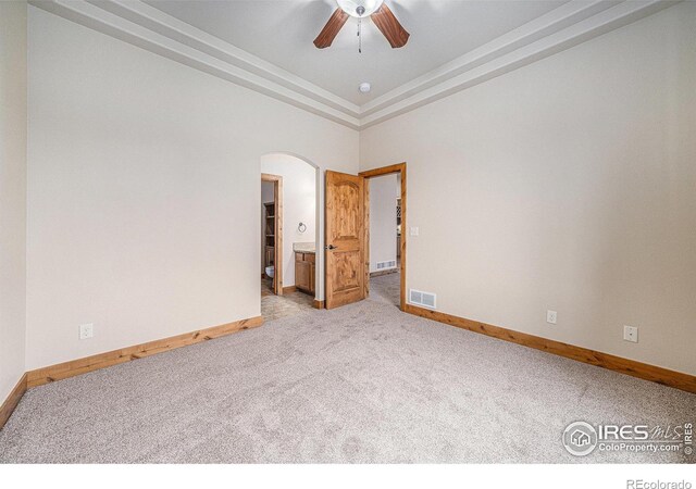 20199 Leola Way, Eaton, CO 80615 - carpeted empty room with a ceiling fan and arched walkways