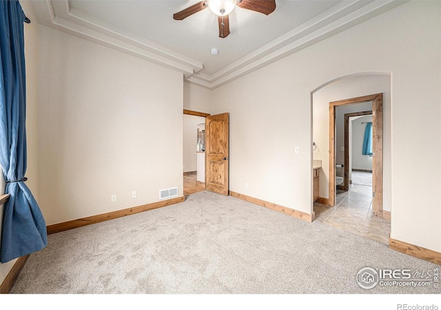 20199 Leola Way, Eaton, CO 80615 - unfurnished room featuring light colored carpet, arched walkways, ceiling fan, and crown molding