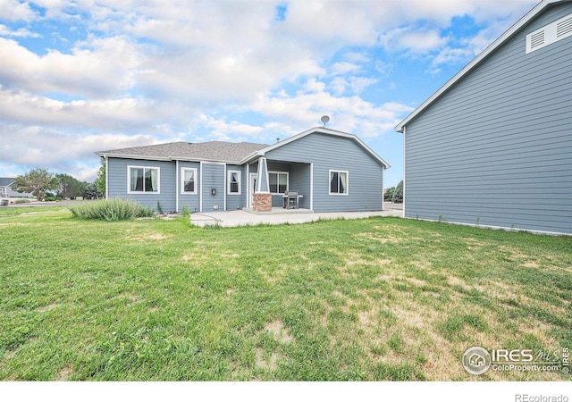 20199 Leola Way, Eaton, CO 80615 - back of property with a patio area and a yard