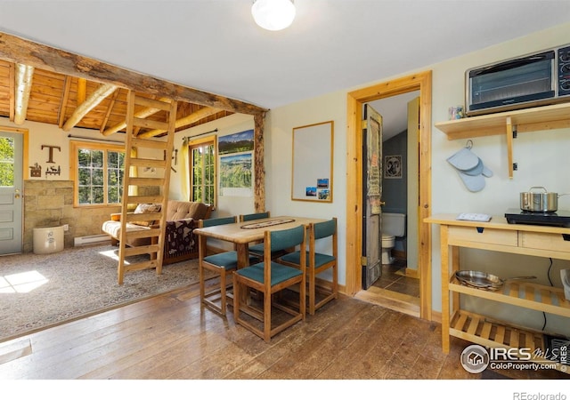 11614 Peak To Peak Hwy, Allenspark, CO 80510 - dining room with wood-type flooring, baseboard heating, and beamed ceiling
