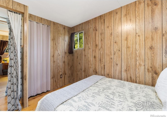 11614 Peak To Peak Hwy, Allenspark, CO 80510 - bedroom with wood finished floors and wood walls