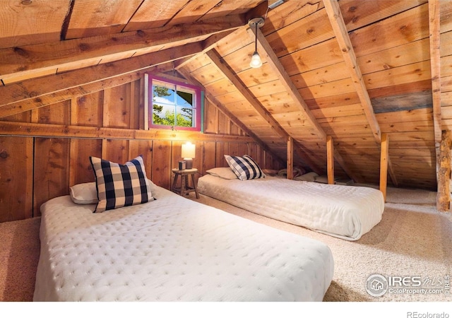 11614 Peak To Peak Hwy, Allenspark, CO 80510 - bedroom featuring lofted ceiling, wooden walls, wood ceiling, and carpet flooring