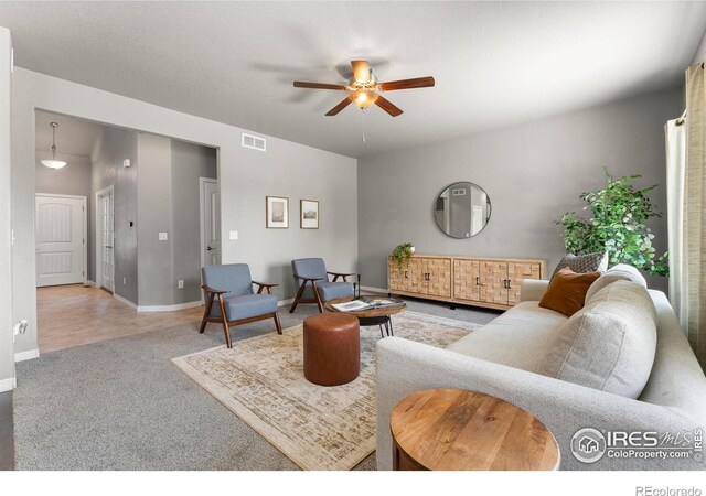 5612 Osbourne Dr, Windsor, CO 80550 - carpeted living area with ceiling fan and baseboards