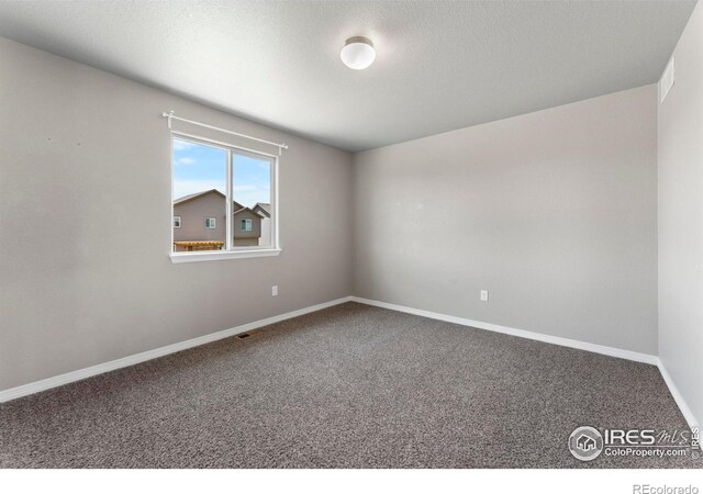 5612 Osbourne Dr, Windsor, CO 80550 - empty room featuring carpet flooring and a textured ceiling