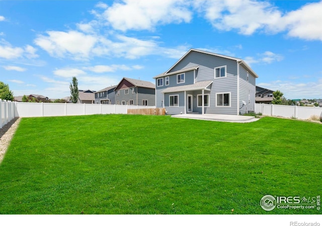 5612 Osbourne Dr, Windsor, CO 80550 - rear view of property featuring a patio area and a fenced backyard