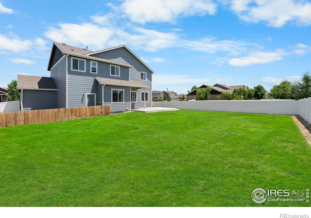 5612 Osbourne Dr, Windsor, CO 80550 - rear view of property featuring a patio area and a fenced backyard