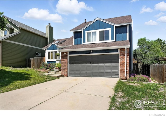 3593 S Gibralter Cir, Aurora, CO 80013 - view of front of property with brick siding, a garage, concrete driveway, and board and batten siding