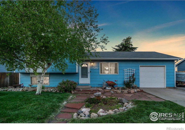 3920 Windom St, Fort Collins, CO 80526 - view of front of home with a garage, concrete driveway, a front lawn, and a shingled roof