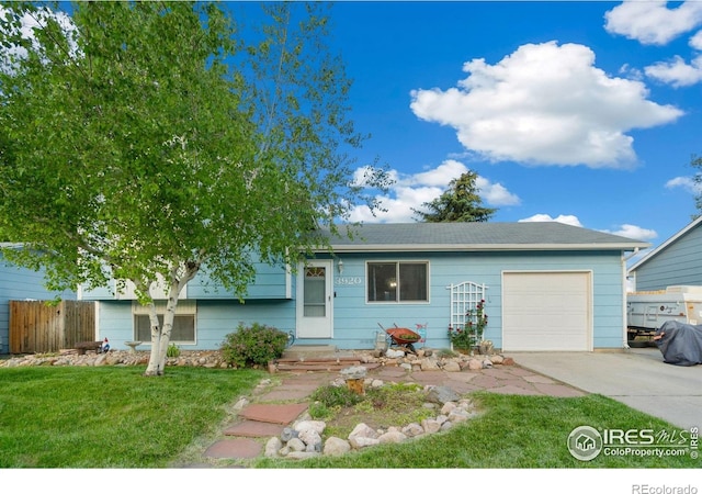 3920 Windom St, Fort Collins, CO 80526 - view of front facade featuring a garage, concrete driveway, and a front yard