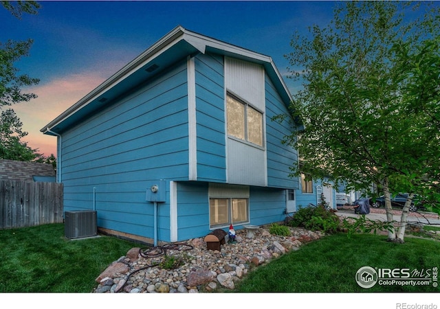 3920 Windom St, Fort Collins, CO 80526 - property exterior at dusk with a central air condition unit