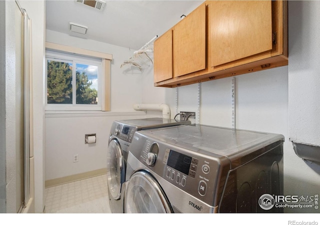 3920 Windom St, Fort Collins, CO 80526 - laundry area featuring cabinet space, separate washer and dryer, and light flooring