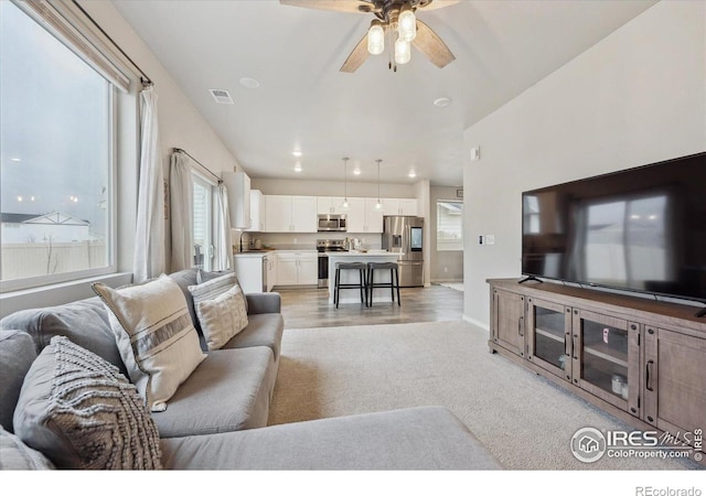 362 Bozeman Trl, Ault, CO 80610 - living area with ceiling fan and light colored carpet