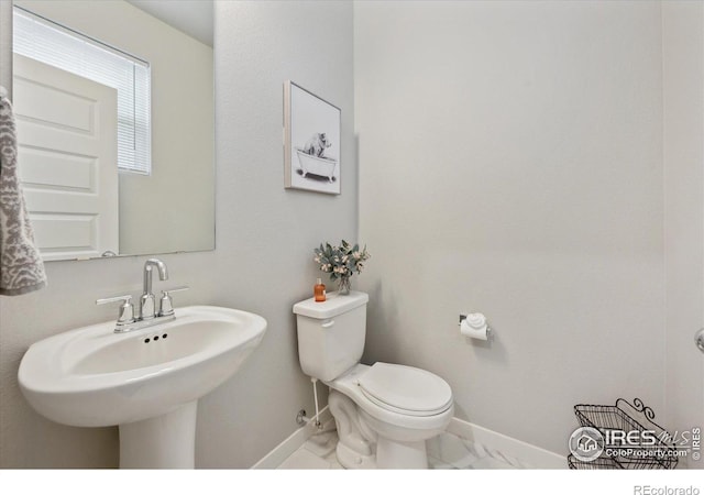 362 Bozeman Trl, Ault, CO 80610 - bathroom with baseboards and marble look tiles