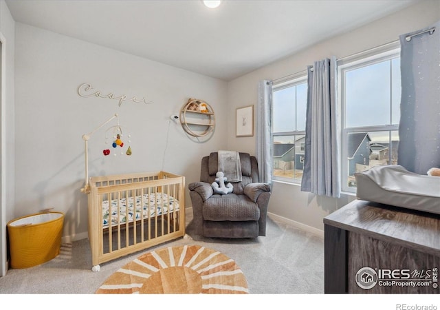362 Bozeman Trl, Ault, CO 80610 - bedroom with carpet floors and a crib