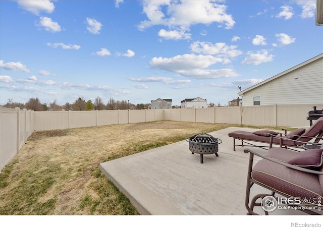 362 Bozeman Trl, Ault, CO 80610 - fenced backyard with an outdoor fire pit and a patio area